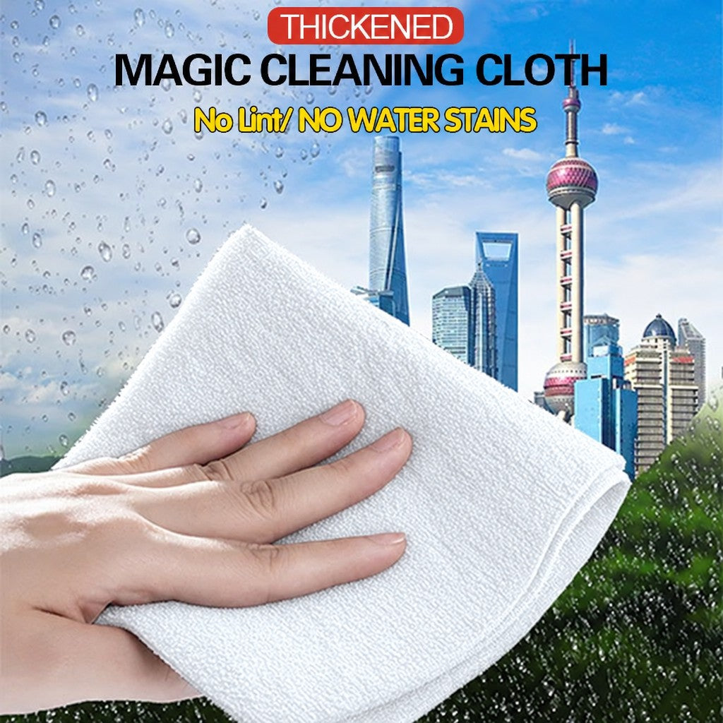White XXL thickened magic cleaning cloth wiping a window